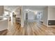 Spacious living area with wood-look floors flowing into the kitchen and dining spaces at 329 W Red Cross Rd, Oakboro, NC 28129