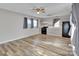 Bright and spacious living room with new gray paint, wood look floors, and updated kitchen at 329 W Red Cross Rd, Oakboro, NC 28129