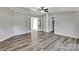 Living room featuring wood-look floors, neutral paint, and a ceiling fan at 329 W Red Cross Rd, Oakboro, NC 28129