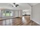 An open-concept living room featuring stylish wood-look floors and ample natural light at 329 W Red Cross Rd, Oakboro, NC 28129