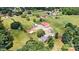 Aerial view of property, featuring multiple buildings, trees and open land at 3724 County Home Rd, Conover, NC 28613