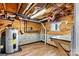 Basement room with vinyl flooring, wood paneling, and an A.O. Smith water heater at 3724 County Home Rd, Conover, NC 28613
