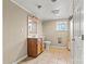 Bathroom with tile floors, oak vanity, framed mirror, and standard toilet at 3724 County Home Rd, Conover, NC 28613
