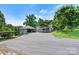 A full view of the home exterior shows ample parking, garage and basketball hoop at 3724 County Home Rd, Conover, NC 28613