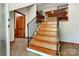 A grand wooden staircase with iron railing accents the foyer of this home at 3724 County Home Rd, Conover, NC 28613