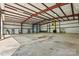Vast interior of a metal building, showing concrete flooring and high ceilings with open bay doors at 3724 County Home Rd, Conover, NC 28613