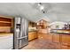 Spacious kitchen featuring stainless steel appliances, custom cabinets, and tile floors at 3724 County Home Rd, Conover, NC 28613
