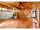 Open living area featuring wood walls and ceiling, hardwood floors, and natural light at 3724 County Home Rd, Conover, NC 28613