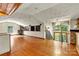 The living room features wood floors, vaulted ceilings, a fireplace, and access to an outdoor balcony at 3724 County Home Rd, Conover, NC 28613