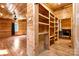 Open living area featuring wood walls and ceiling, hardwood floors, and natural light at 3724 County Home Rd, Conover, NC 28613