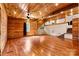 Open living area featuring wood walls and ceiling, hardwood floors, and natural light at 3724 County Home Rd, Conover, NC 28613