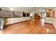 A full view of the living room shows hardwood floors, fireplace and staircase at 3724 County Home Rd, Conover, NC 28613