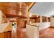 Open living area featuring wood walls and ceiling, hardwood floors, and natural light at 3724 County Home Rd, Conover, NC 28613