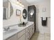 Bathroom featuring double sinks, modern fixtures and decorative mirrors at 3906 Brickfield St, Hickory, NC 28602