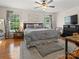 Spacious bedroom features a ceiling fan, a large window and a comfortable king-sized bed at 3906 Brickfield St, Hickory, NC 28602