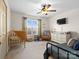 Cozy bedroom with modern ceiling fan, and ample room for children and guests at 3906 Brickfield St, Hickory, NC 28602