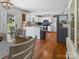 Open kitchen flowing from dining area with white cabinets and stainless steel appliances at 3906 Brickfield St, Hickory, NC 28602