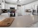 Bright kitchen featuring white cabinetry, stainless steel appliances, and solid surface countertops at 3906 Brickfield St, Hickory, NC 28602