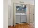 Convenient laundry area with modern washer and dryer, storage shelves, and easy access at 3906 Brickfield St, Hickory, NC 28602