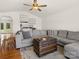 Cozy living room features a vaulted ceiling, stylish decor, and hardwood floors with area rug at 3906 Brickfield St, Hickory, NC 28602