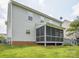 The exterior view shows a home featuring a screened-in porch and a spacious backyard lawn at 4090 Sunset Dr, Rock Hill, SC 29732
