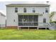 Exterior view of the house showcasing a spacious backyard and a screened-in porch, ideal for outdoor living at 4090 Sunset Dr, Rock Hill, SC 29732