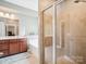 Bright bathroom with double vanity, soaking tub, and glass-enclosed shower with neutral tile at 4090 Sunset Dr, Rock Hill, SC 29732