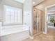 A well-lit bathroom with a soaking tub, separate shower, and large window for natural light at 4090 Sunset Dr, Rock Hill, SC 29732