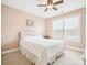 Cozy bedroom featuring a ceiling fan, a bright window, and a comfortable bed with a tufted headboard at 4090 Sunset Dr, Rock Hill, SC 29732