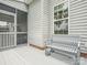 Charming outdoor deck with a cozy bench seating, adjacent to the screened porch, perfect for relaxing outside at 4090 Sunset Dr, Rock Hill, SC 29732