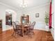 Traditional dining room features a hardwood floor and classic wainscotting at 4090 Sunset Dr, Rock Hill, SC 29732