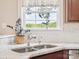 Bright kitchen showcasing a double stainless steel sink and a window with a lovely outdoor view at 4090 Sunset Dr, Rock Hill, SC 29732