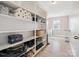 Bright laundry room with open shelving and ample storage for supplies and accessories at 4090 Sunset Dr, Rock Hill, SC 29732