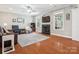 Open-concept living room with hardwood floors, a fireplace, and lots of natural light at 4090 Sunset Dr, Rock Hill, SC 29732