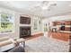 Bright living room with an open-concept design and a view of the kitchen and fireplace at 4090 Sunset Dr, Rock Hill, SC 29732