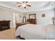 Serene main bedroom with a tray ceiling, fireplace, and an ensuite bathroom at 4090 Sunset Dr, Rock Hill, SC 29732