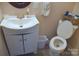 Cozy bathroom featuring a toilet, vanity with sink, and modern fixtures at 4143 E Maiden Rd, Maiden, NC 28650