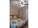 Bedroom featuring a bed with floral-patterned bedding, ceiling fan, and closet for convenient storage at 4143 E Maiden Rd, Maiden, NC 28650