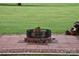 Outdoor fire pit constructed with brick and paving stones, inviting gatherings at 4143 E Maiden Rd, Maiden, NC 28650