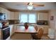 Bright kitchen with modern appliances, cabinetry, and a central island at 4143 E Maiden Rd, Maiden, NC 28650