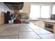 Spacious kitchen featuring tile countertops, modern appliances, and a bright window at 4143 E Maiden Rd, Maiden, NC 28650