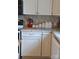 Close up of kitchen counter with white cabinets and neutral tiled back splash at 4143 E Maiden Rd, Maiden, NC 28650