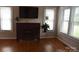 Cozy living room featuring a brick fireplace and hardwood floors, great natural light at 4143 E Maiden Rd, Maiden, NC 28650