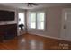 Inviting living room with fireplace, hardwood floors, and plenty of natural light at 4143 E Maiden Rd, Maiden, NC 28650