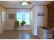 Cozy living room featuring a brick fireplace and an air conditioner for comfortable living at 4143 E Maiden Rd, Maiden, NC 28650