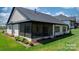 Delightful backyard featuring a screened-in porch, perfect for outdoor dining and entertaining in comfort at 4210 Holly Ne Cir, Conover, NC 28613
