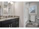 Bathroom featuring granite countertops and dark cabinetry at 4210 Holly Ne Cir, Conover, NC 28613