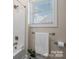 Bathtub and towel rack next to a window at 4210 Holly Ne Cir, Conover, NC 28613