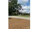 Clubhouse exterior with lush landscaping, flags, and parking at 4210 Holly Ne Cir, Conover, NC 28613