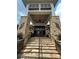 Clubhouse entrance with stone steps, stone columns, metal railings, and a covered entry at 4210 Holly Ne Cir, Conover, NC 28613